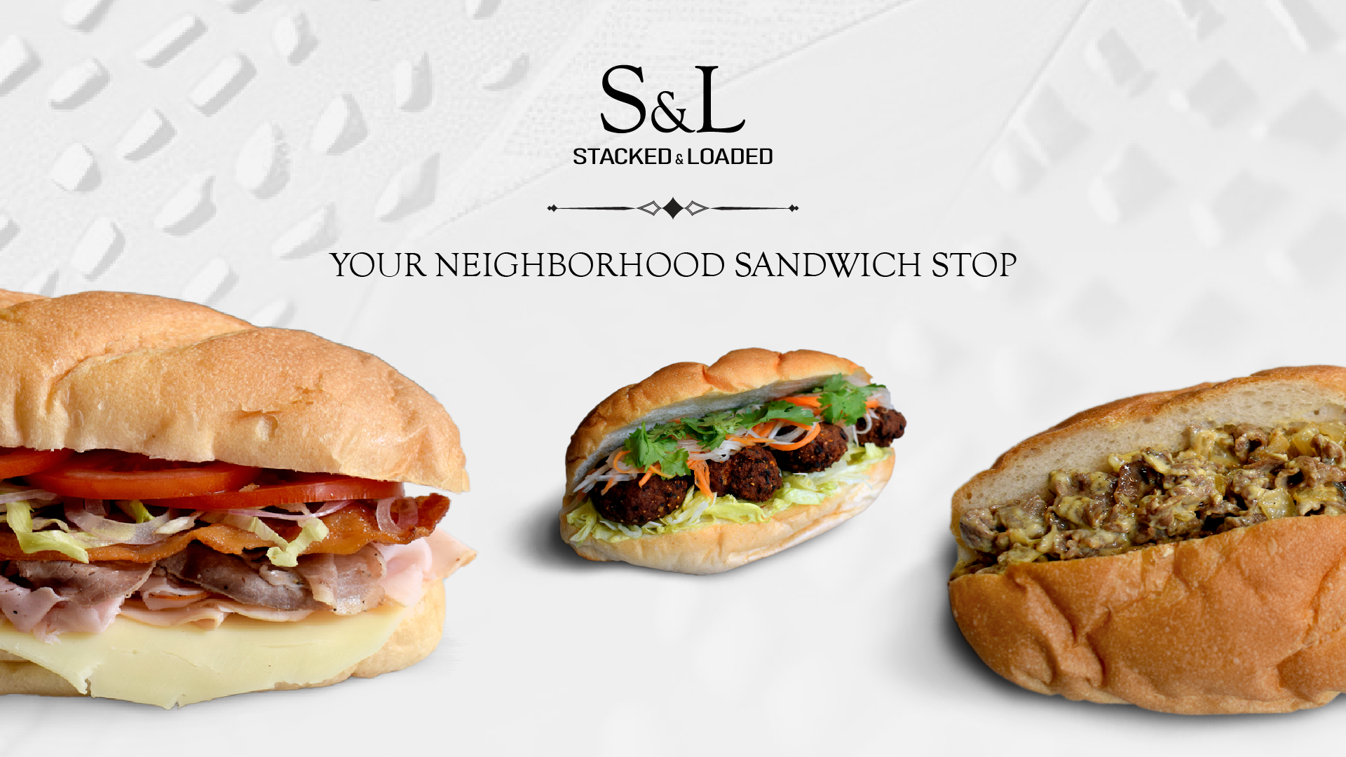 Thai balls on bread sandwich amongst other sandwiches on white background with STacked nad Loaded logo and title stating Your Neighborhood Sandwich Stop
